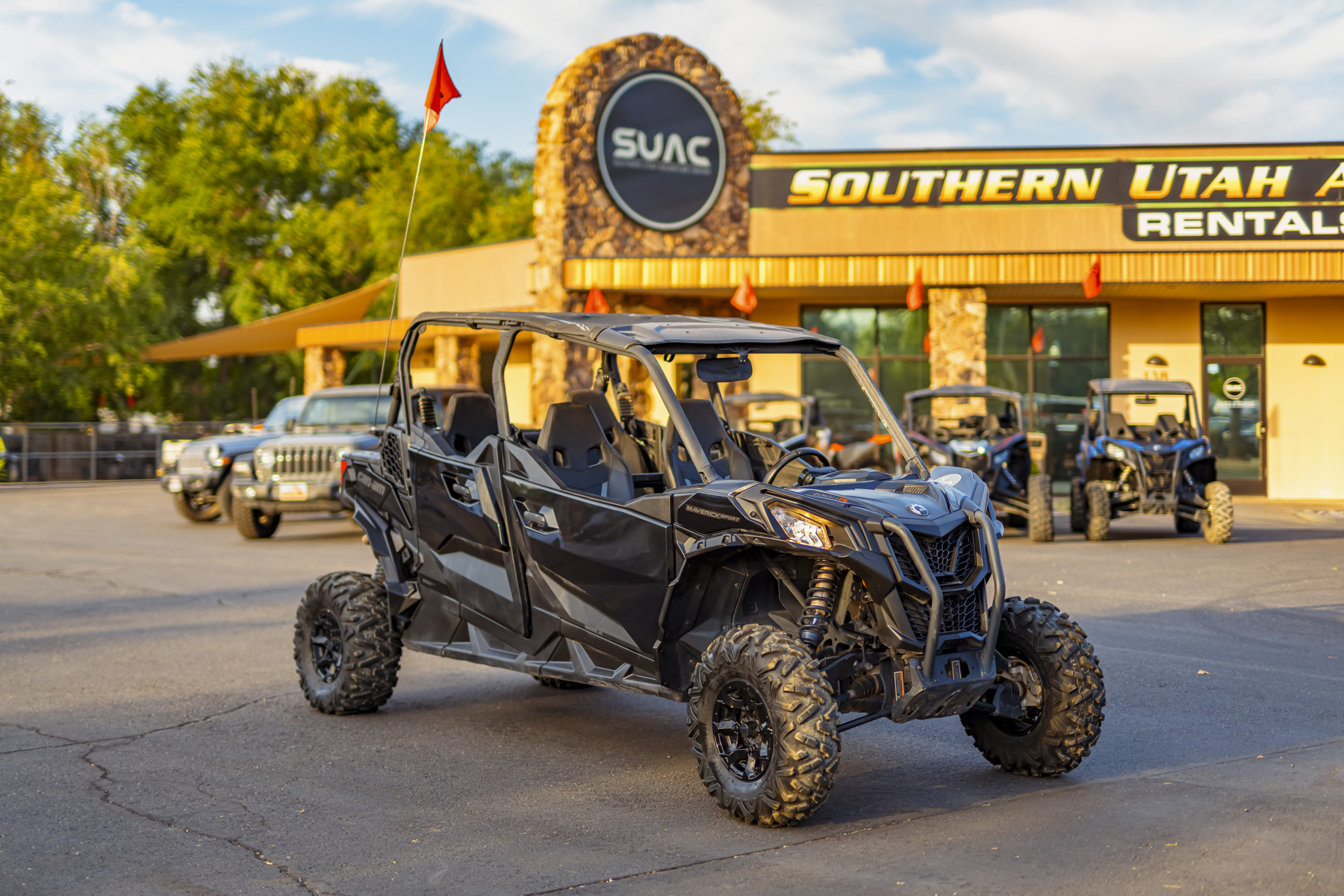 Black Can-Am Maverick Sport Max UTV parked at Southern Utah Adventure Center, perfect for family off-road adventures near Sand Hollow and Zion National Park