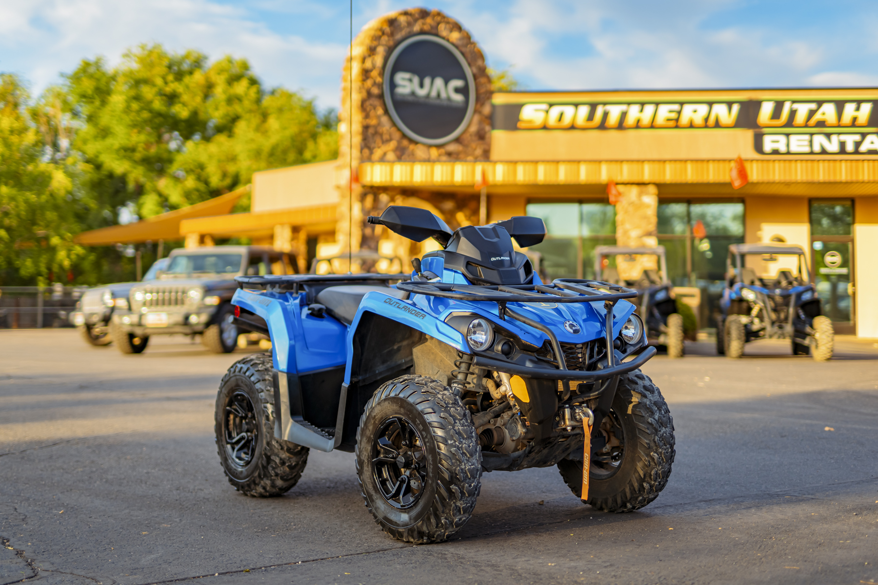 Blue Can-Am Outlander 570 ATV rental at Southern Utah Adventure Center, ideal for exploring Sand Hollow trails and Southern Utah off-road terrain.